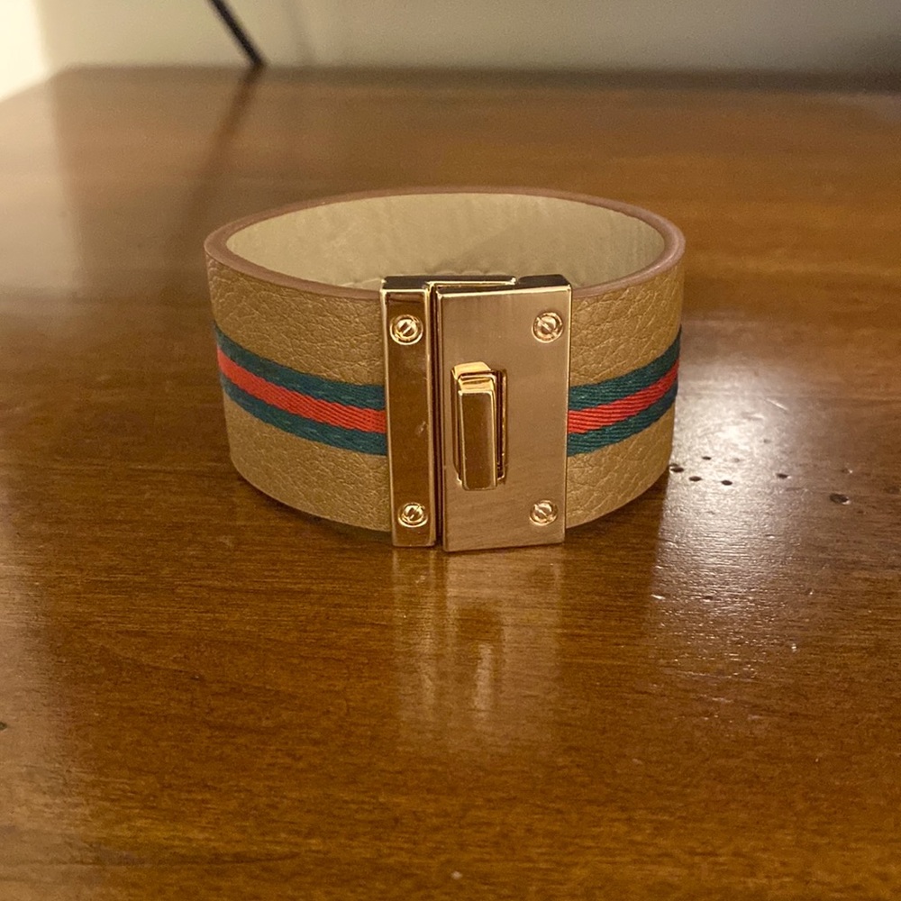 Saddle leather cuff bracelet with gold metal hardware turnkey closure